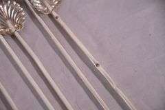 Set of 8 sterling silver shell-shaped sipper stirrers; 971-275