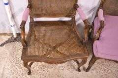 Pair of carved French style open armchairs with cane seats and backs; 68-6922