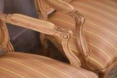 Pair of carved French style open armchairs with striped fabric; 68-6881