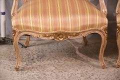 Pair of carved French style open armchairs with striped fabric; 68-6881