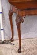 Carved mahogany flip-top table; 74-12753