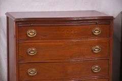 Pair of mahogany serpentine front 4 drawer bachelor's chests with brushing slides; 68-6916