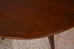 Oval mahogany dining table with 2 skirted leaves; 68-6585A