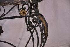 Black and gold iron console table with black marble top; 67-2712