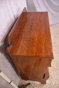 Early crotch mahogany 4 drawer chest with backsplash; 68-6860