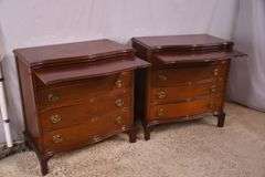 Pair of mahogany serpentine front 4 drawer bachelor's chests with brushing slides; 68-6916