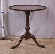 Carved mahogany tilt-top side table with ball in claw feet; 21-2749