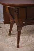 Oval mahogany dining table with 2 skirted leaves; 68-6585A