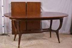 Oval mahogany dining table with 2 skirted leaves; 68-6585A