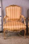 Pair of carved French style open armchairs with striped fabric; 68-6881