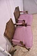 Pair of carved French style open armchairs with cane seats and backs; 68-6922