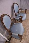 Pair of carved French style open armchairs; 68-6883