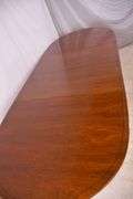 Oval mahogany dining table with 2 skirted leaves; 68-6585A