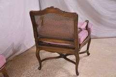 Pair of carved French style open armchairs with cane seats and backs; 68-6922