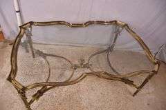 Large gold metal coffee table with glass top; 68-6890