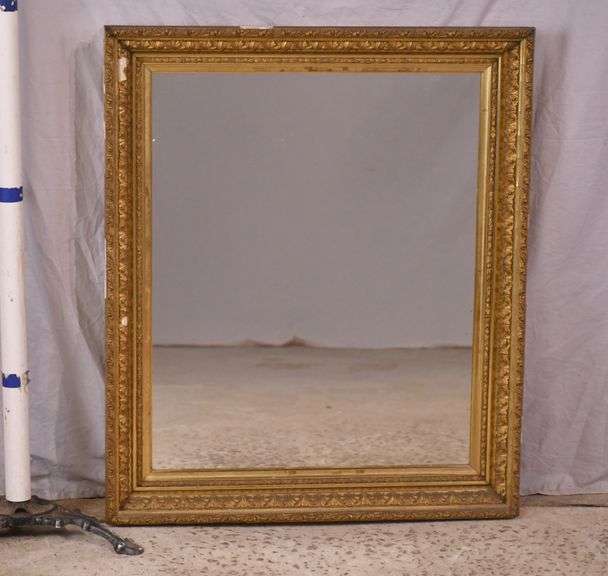 Early mirror with ornate gold frame; 1037-1166