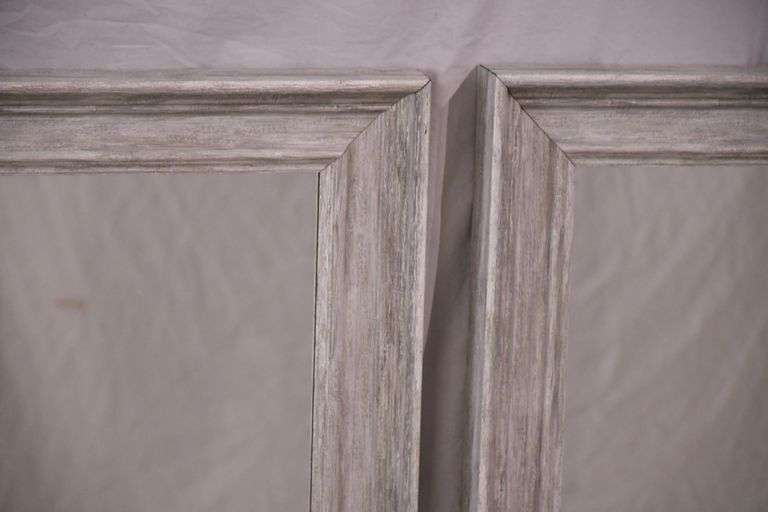 Pair of mirrors with distressed light gray frames; 336-4567