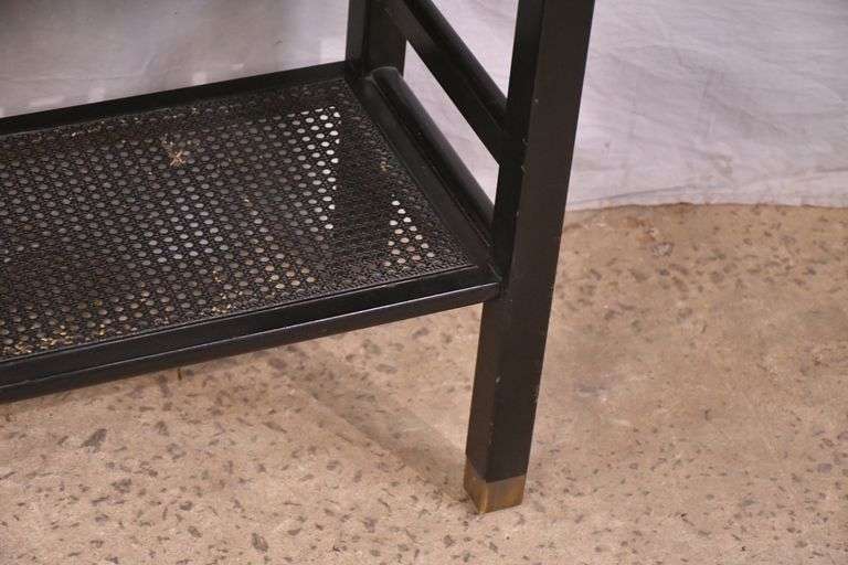 Black Oriental style two-tier console table with cane shelf; 55-12317