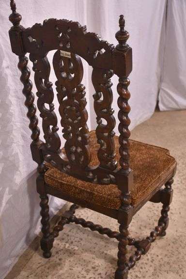Heavily carved accent chair with barley twist legs, columns, and stretchers; 192-3100