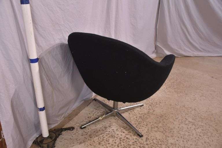 Mid-century style black upholstered tub chair with swivel chrome pedestal; 74-12883