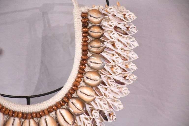 Puka shell necklace on stand; 16780-016