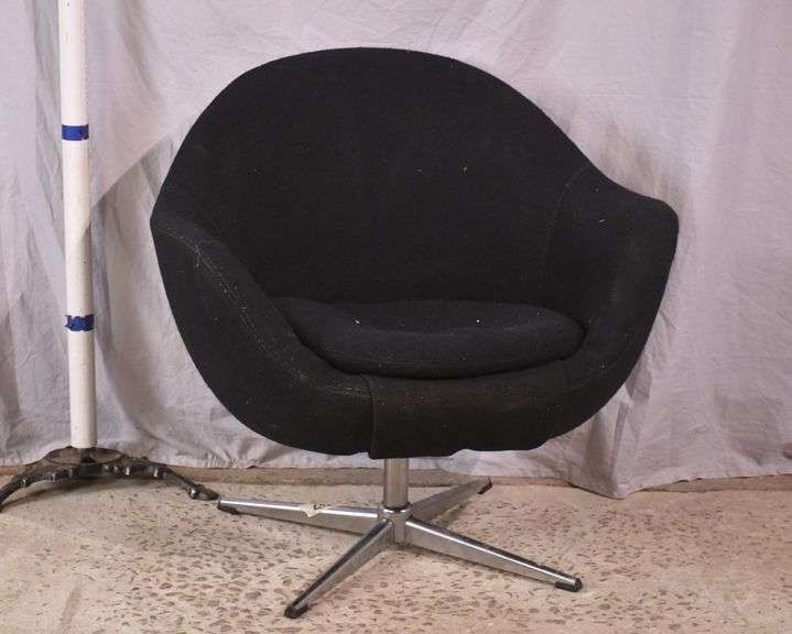 Mid-century style black upholstered tub chair with swivel chrome pedestal; 74-12883