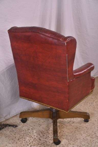 Burgundy tufted vinyl desk chair with swivel tilting seat; 74-12885