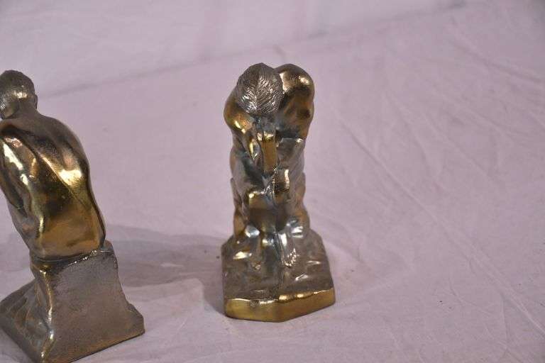 Pair of gold metal Thinking Man bookends; 1037-1159