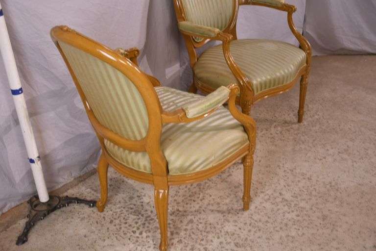 Pair of carved French style open armchairs; 55-12305