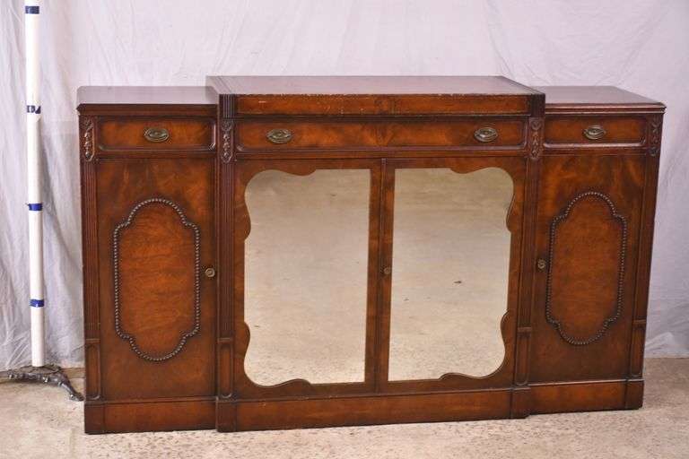 Mahogany credenza with leather top and mirrored doors; 21-2704