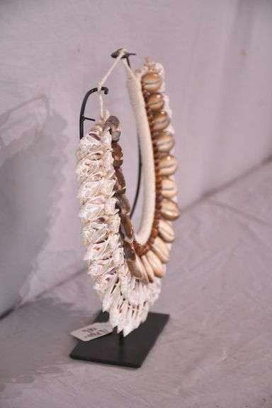 Puka shell necklace on stand; 16780-016