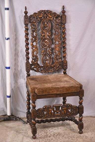 Heavily carved accent chair with barley twist legs, columns, and stretchers; 192-3100