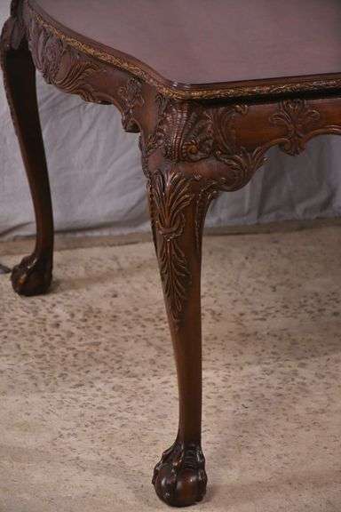 Carved mahogany dining table with ball in claw feet; 74-12884A