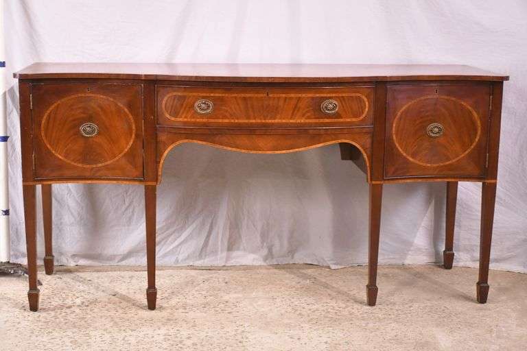 Inlaid crotch mahogany serpentine front sideboard; 74-12887