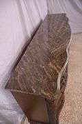 Ashley Furniture Co. large carved serpentine front 9 drawer triple dresser with marble tile top; 1153-098