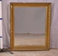 Early mirror with ornate gold frame; 1037-1166