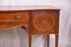 Inlaid crotch mahogany serpentine front sideboard; 74-12887