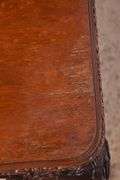 Carved mahogany dining table with ball in claw feet; 74-12884A