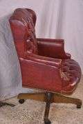 Burgundy tufted vinyl desk chair with swivel tilting seat; 74-12885