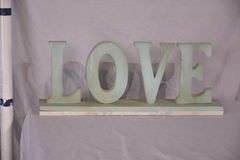 Carved wooden "Love" sign with marble base; 43-163