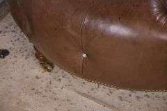 Round tufted leather ottoman; 55-12251