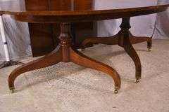 Oval mahogany double pedestal dining table with 3 leaves; 18301-001