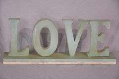 Carved wooden "Love" sign with marble base; 43-163