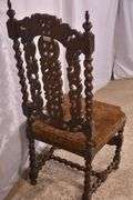 Heavily carved accent chair with barley twist legs, columns, and stretchers; 192-3100