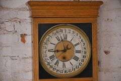 Sessions vintage calendar wall clock with oak case; 10271-065