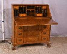 Burl walnut slant-front desk with ball in claw feet; 55-12174