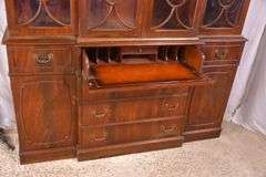 Crotch mahogany 2 part bubble glass breakfront; 74-12886