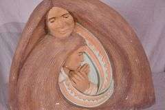 Ceramic sculpture of mother and child by J. Vera; 55-12229