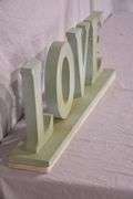 Carved wooden "Love" sign with marble base; 43-163