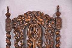 Heavily carved accent chair with barley twist legs, columns, and stretchers; 192-3100